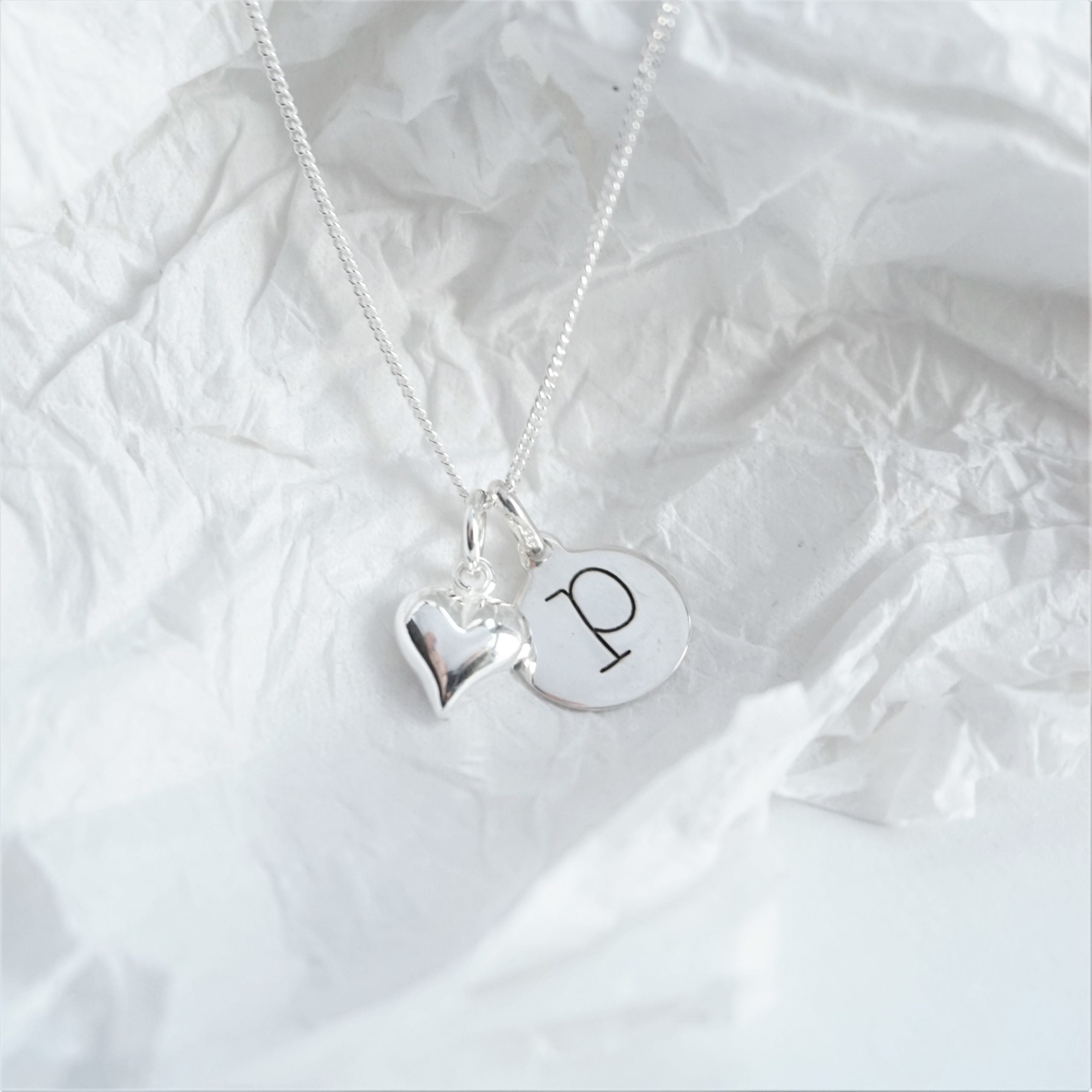 Sterling silver necklace with lowercase initial and heart charm