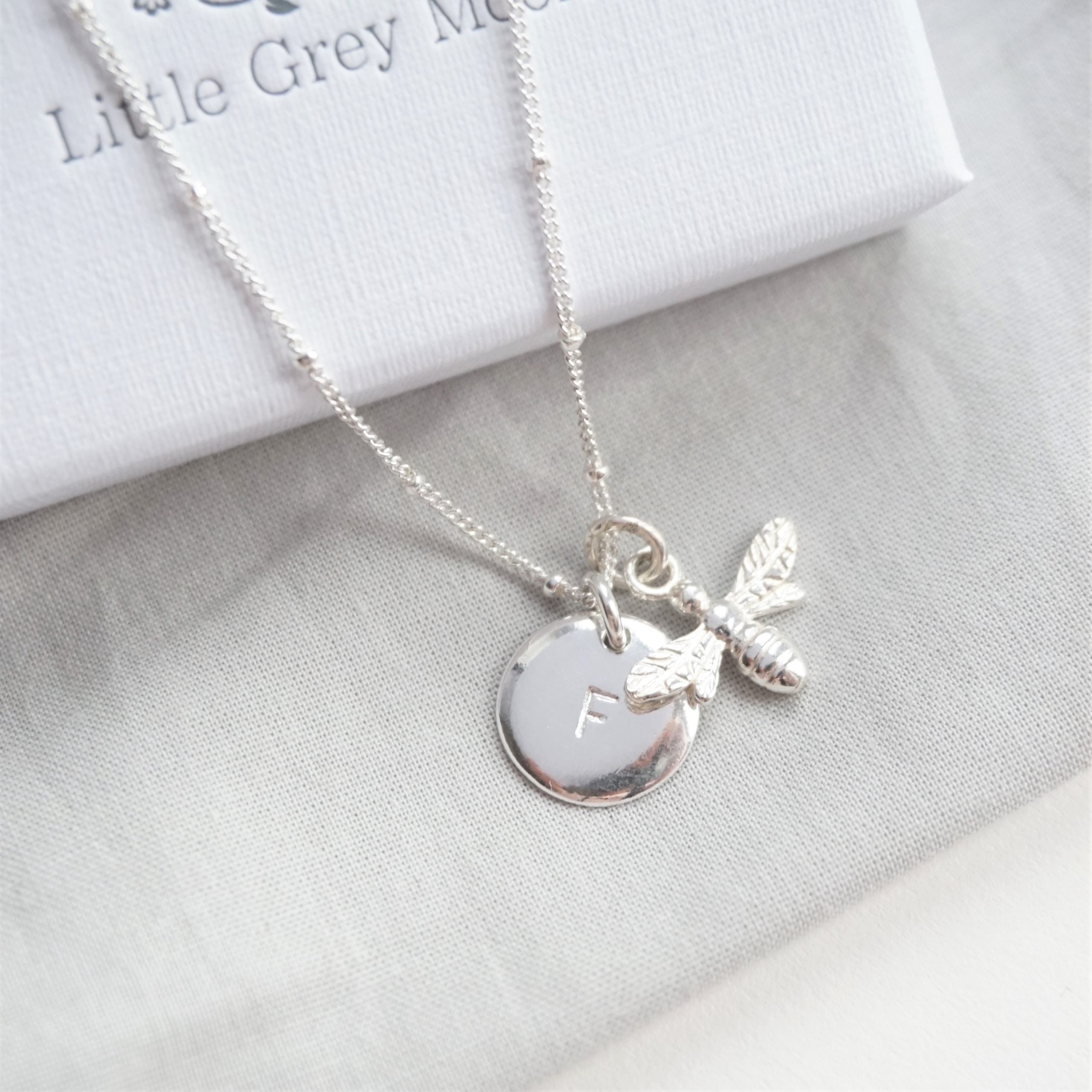 sterling silver stamped disc initial and bee charm