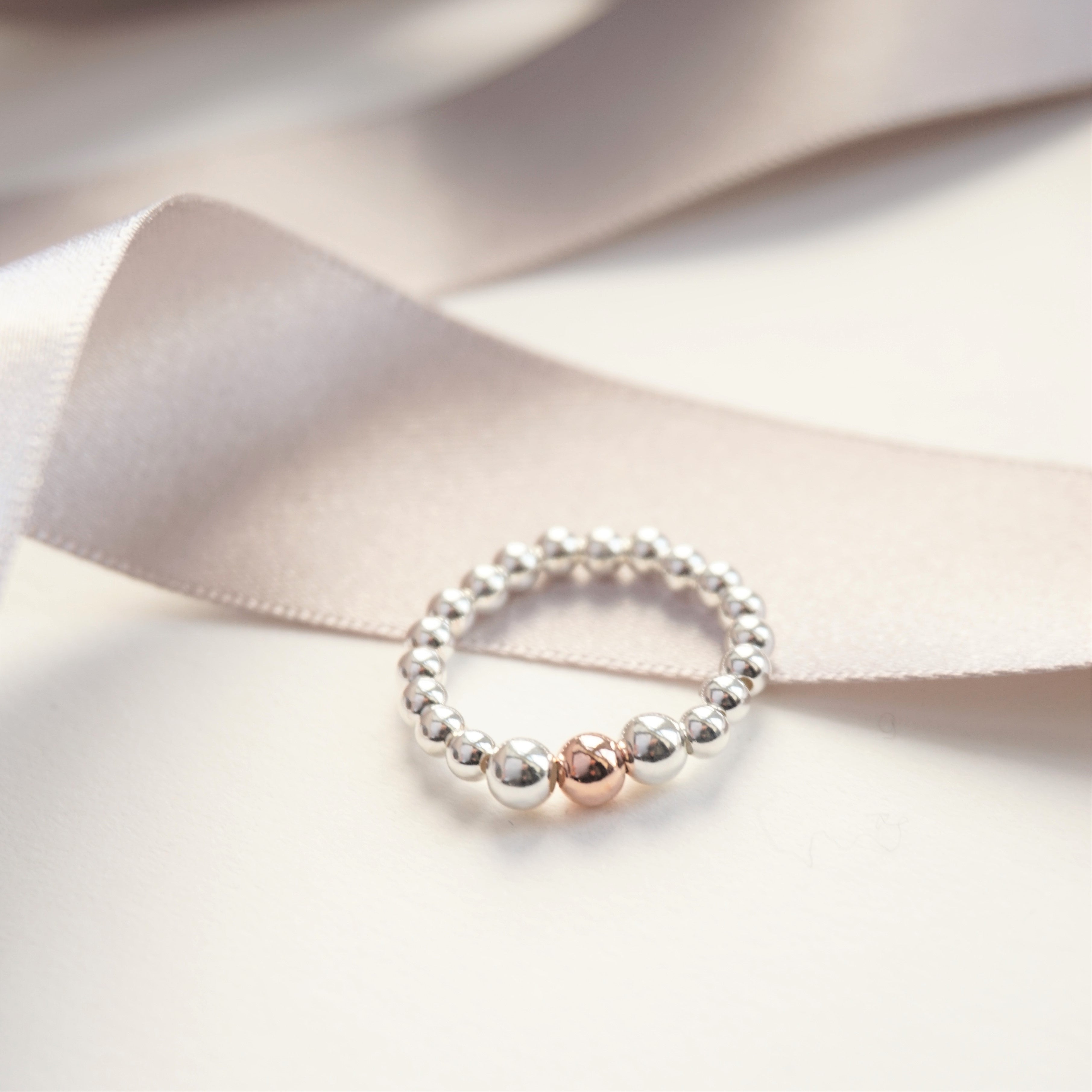 sterling silver ring with rose gold bead