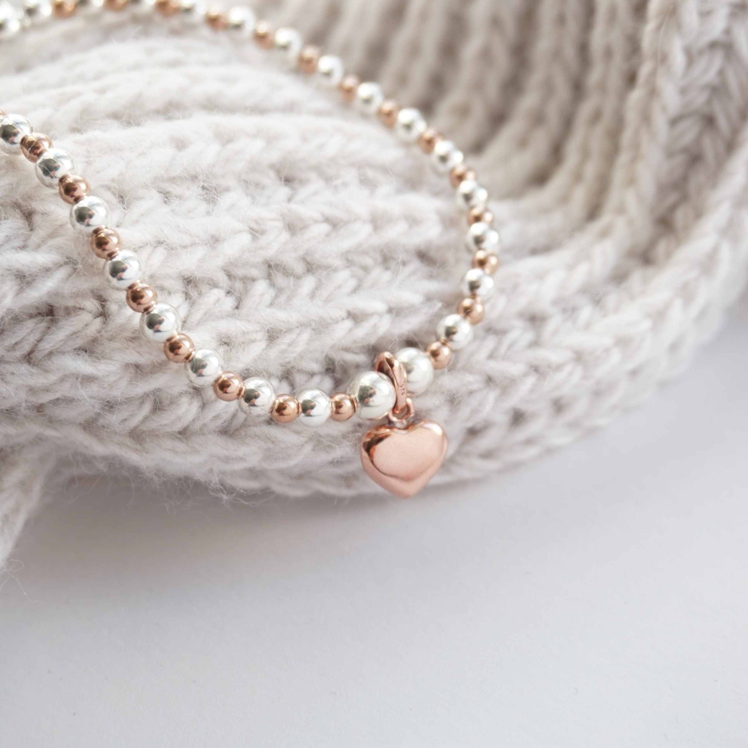 sterling silver and rose gold bracelet with heart charm