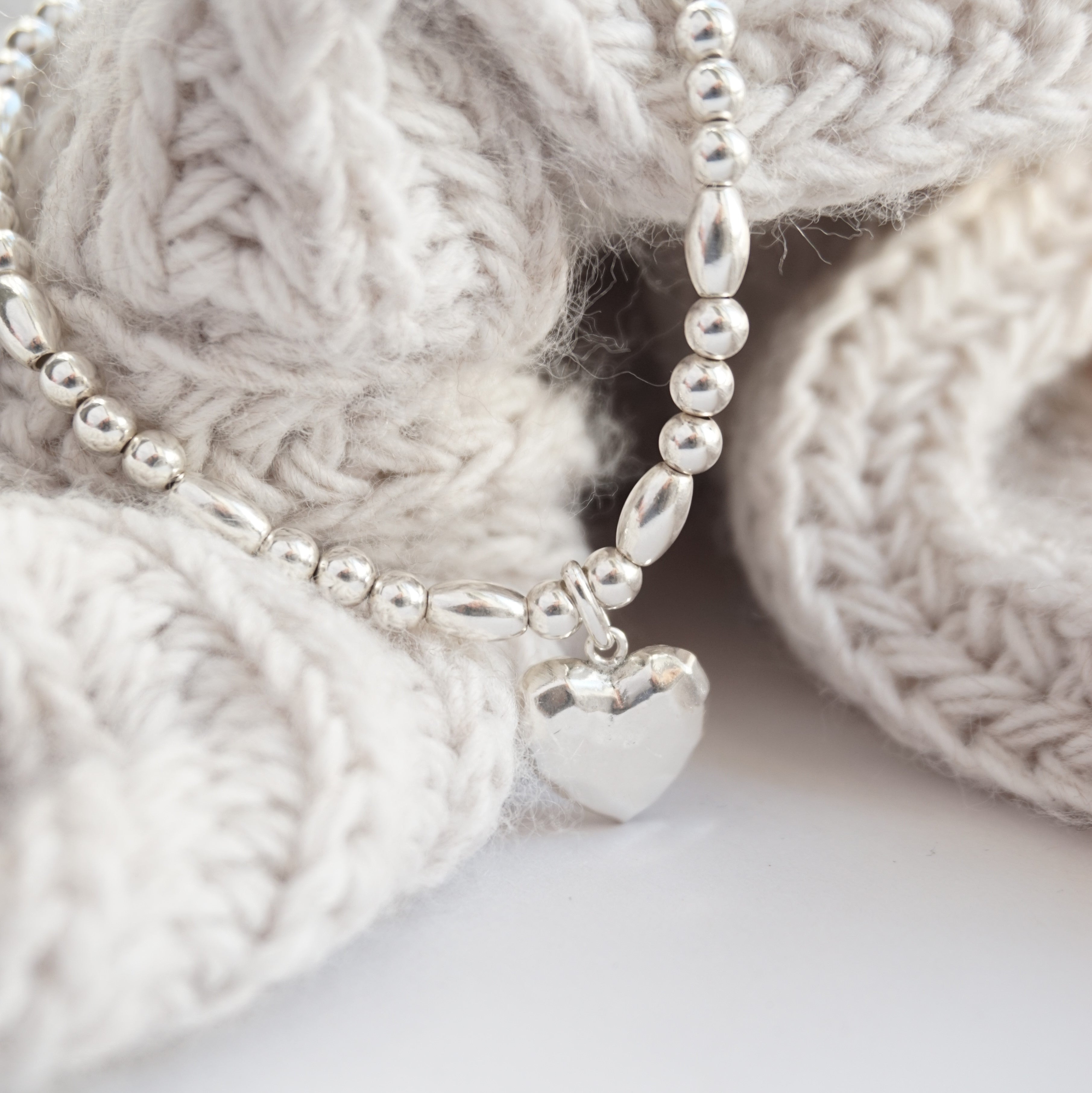 Sterling silver bracelet with hammered heart charm