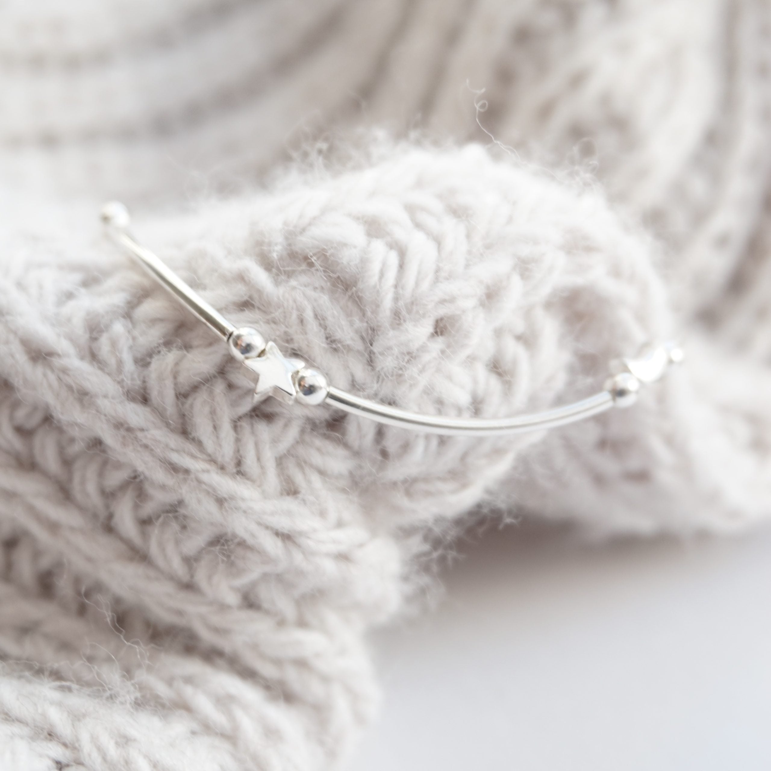 Sterling silver noodle bracelet with star and moon beads