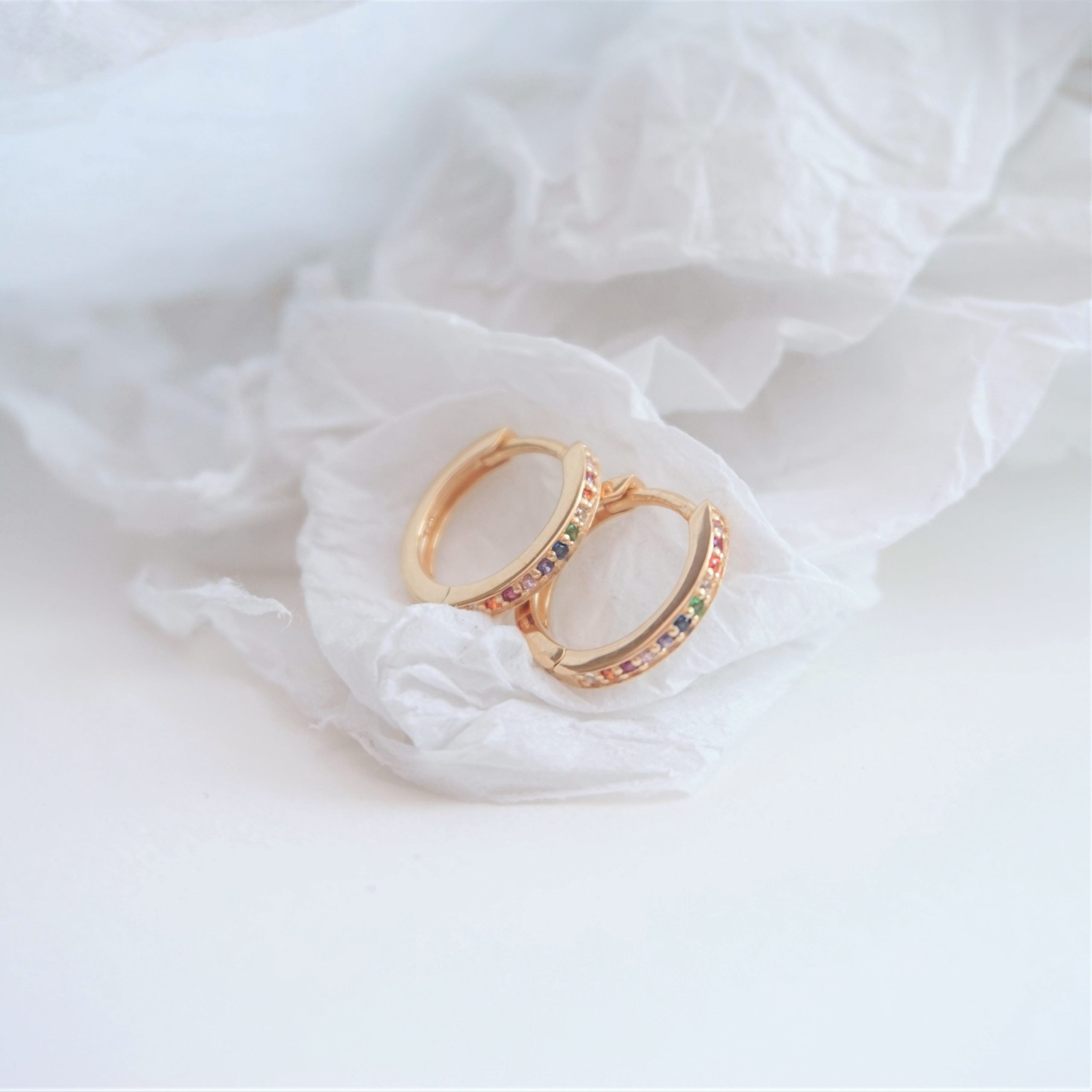 gold rainbow huggie hoop earrings