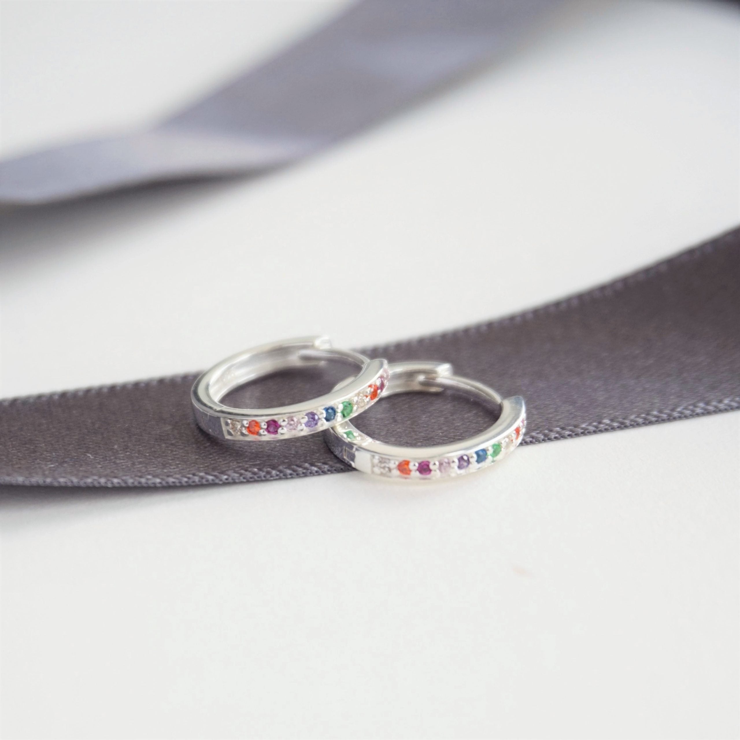 sterling silver huggie rainbow hoop earrings