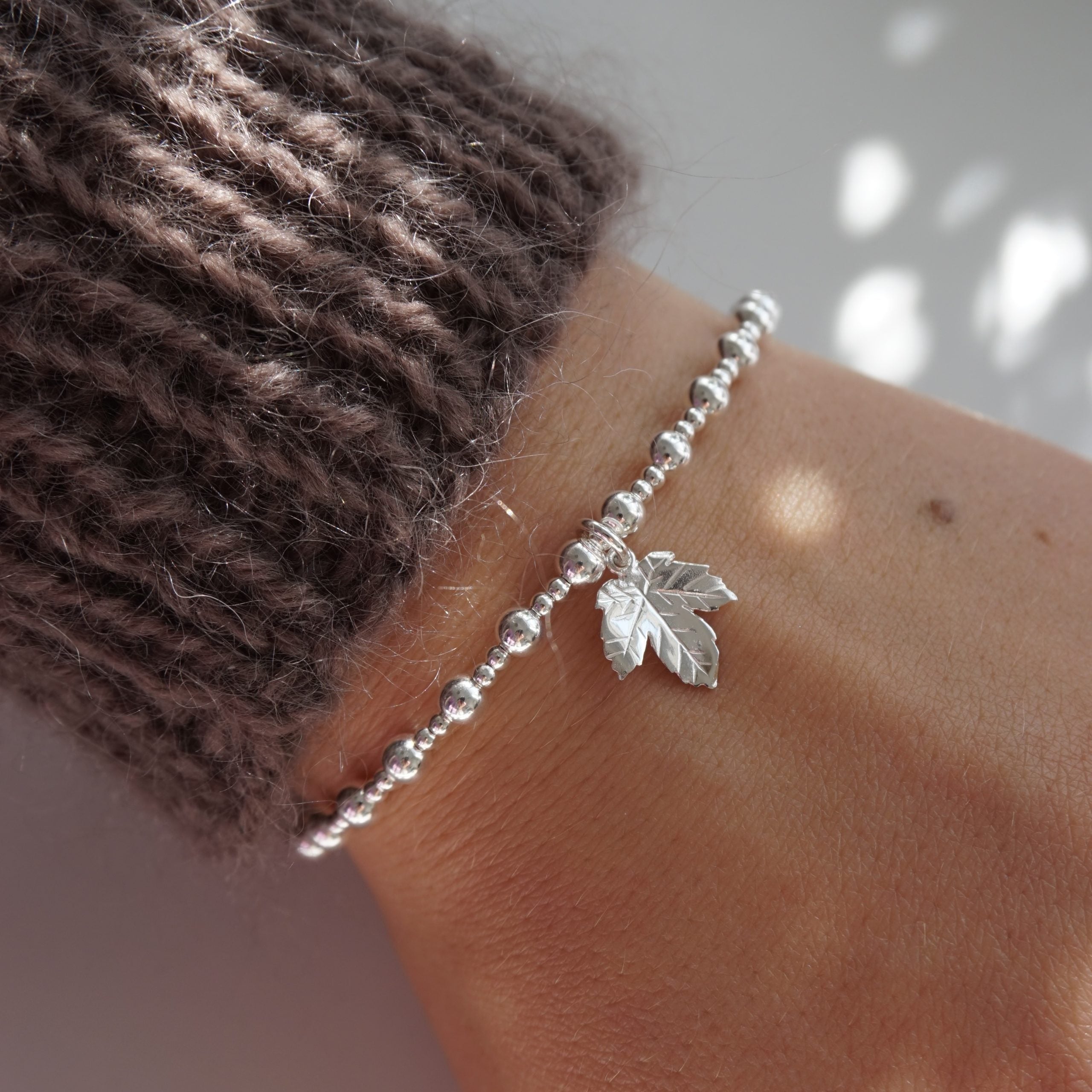 Sterling silver stretch bracelet with leaf charm