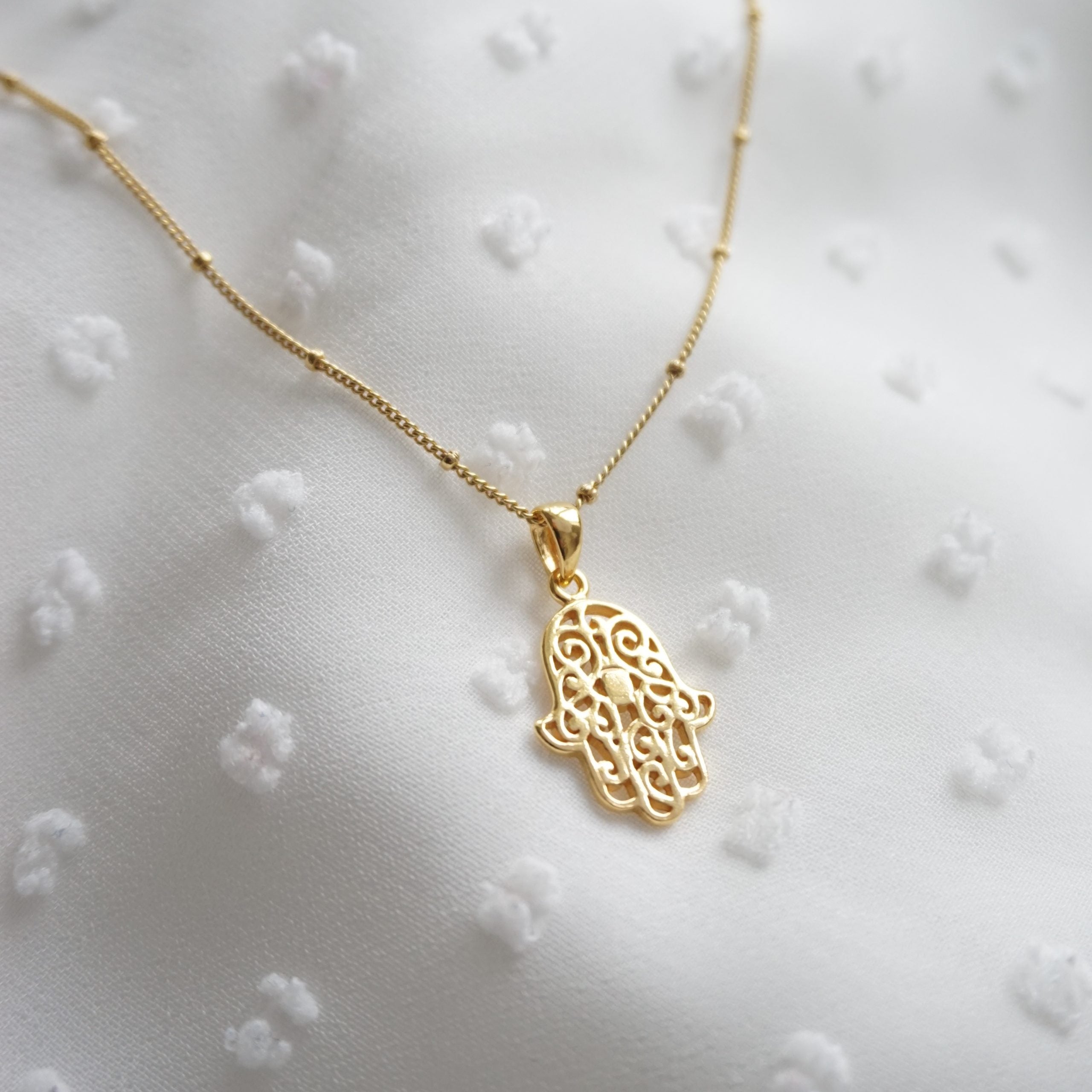 gold hamsa necklace