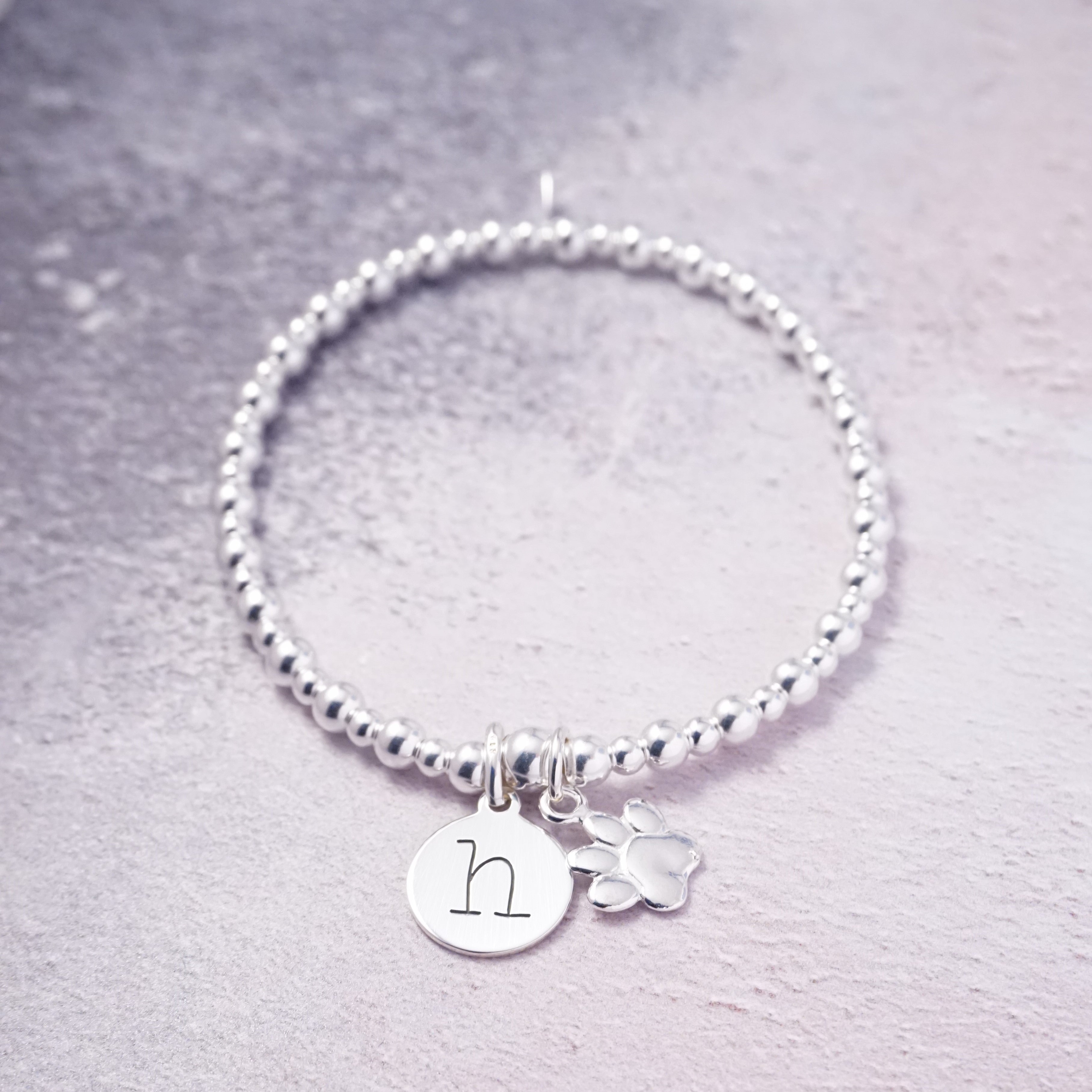 sterling silver initial disc bracelet with paw