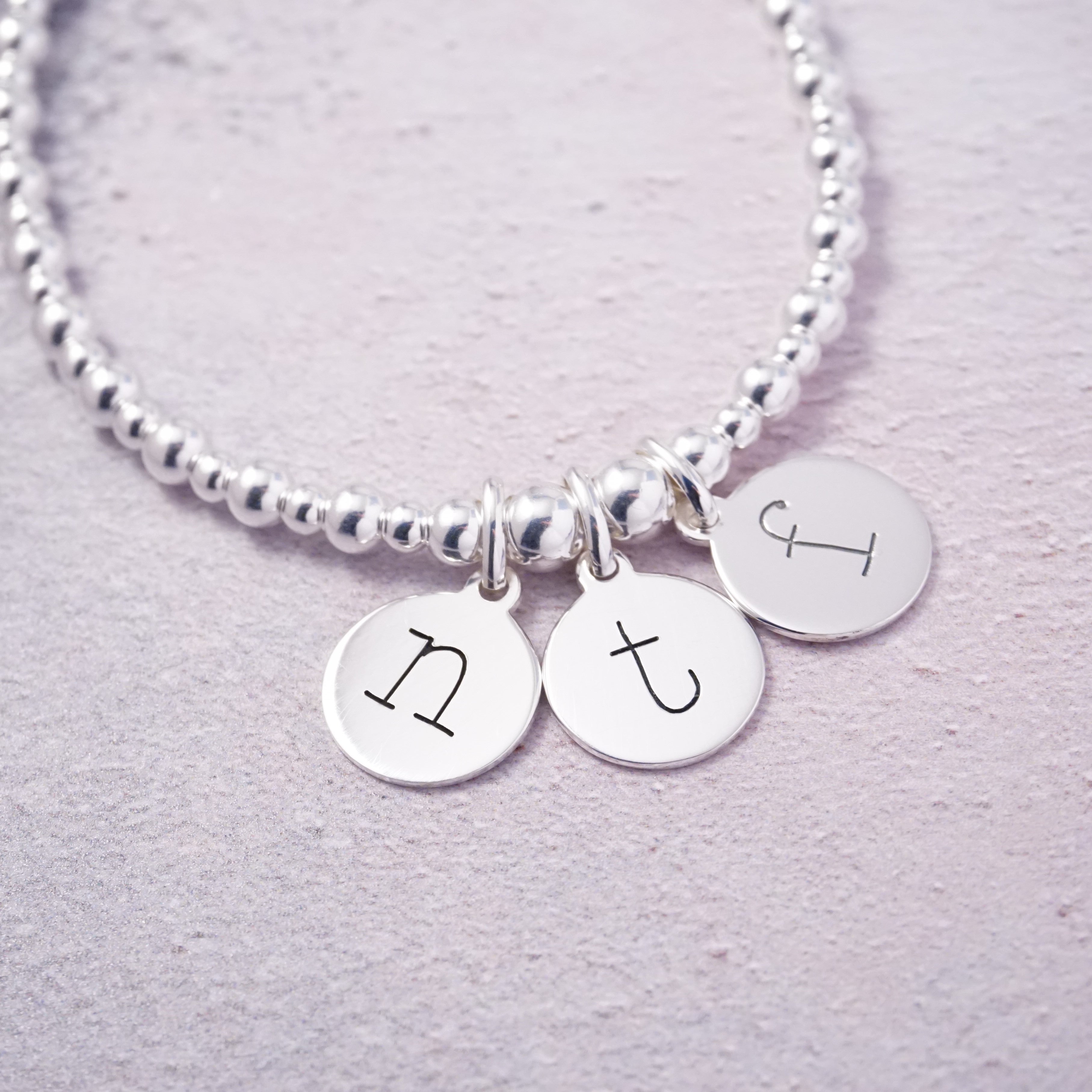 sterling silver initial disc bracelet