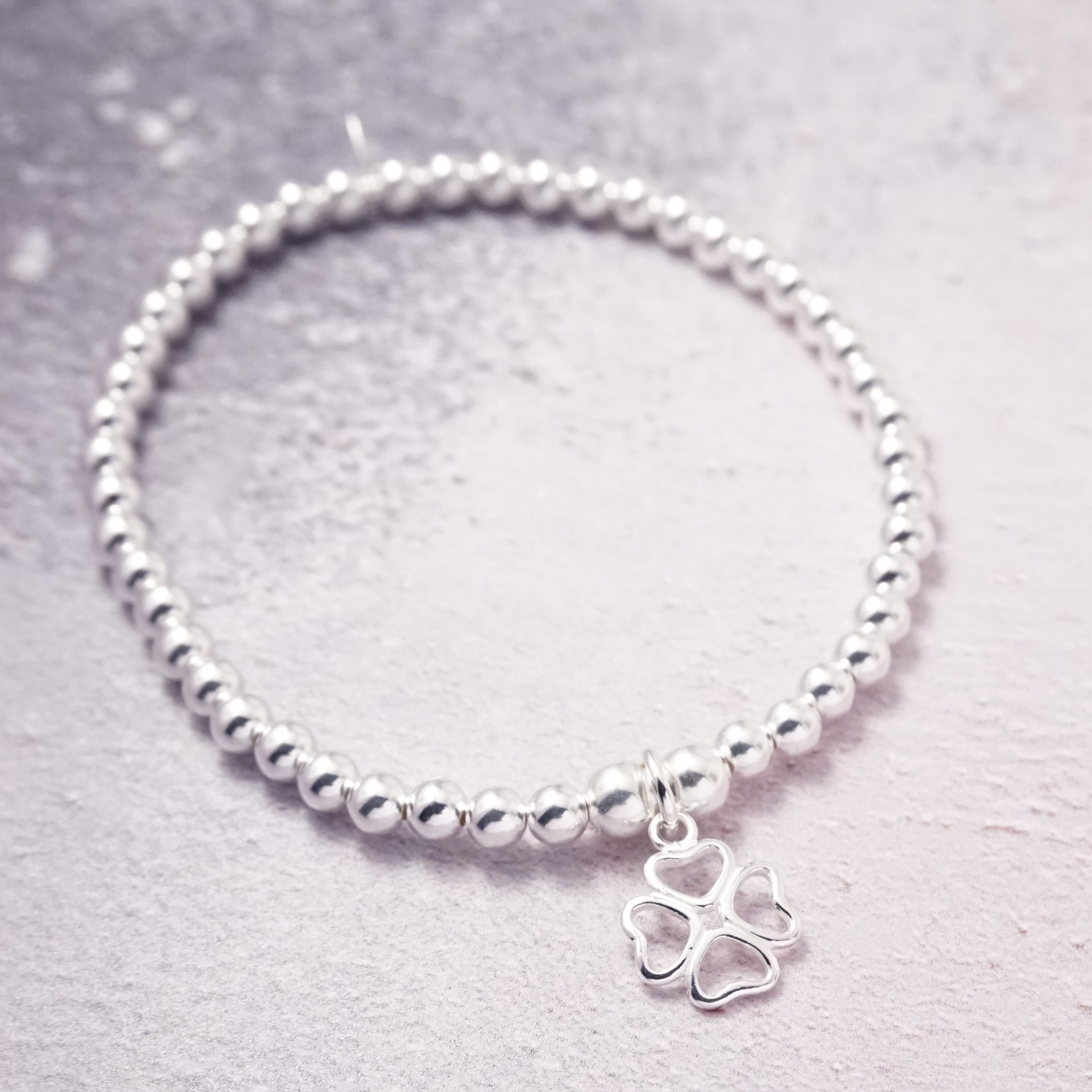 Sterling Silver Stretch Bracelet with Four Leaf Clover Charm