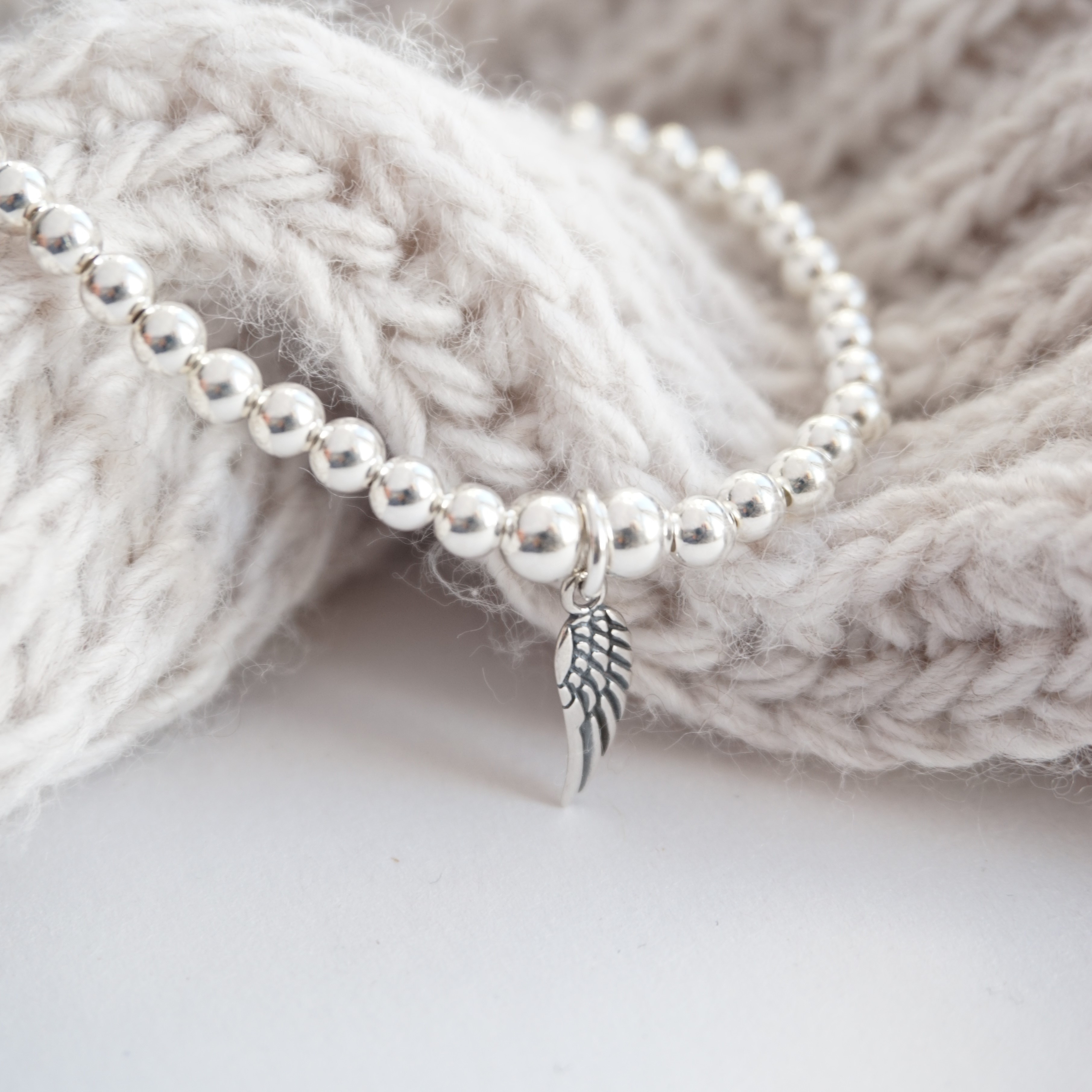 sterling silver bracelet with angel wing charm