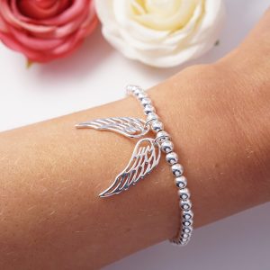 sterling silver bracelet with large angel wing charms