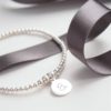 sterling silver bracelet with one lowercase initial charm