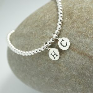 Sterling Silver Stretch Bracelet with Two Small Disc Initial Charms