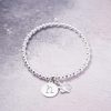 sterling silver initial disc bracelet with paw