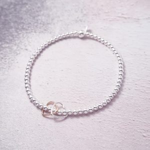 Sterling Silver Stretch Bracelet with Silver and Rose Gold Open Hearts