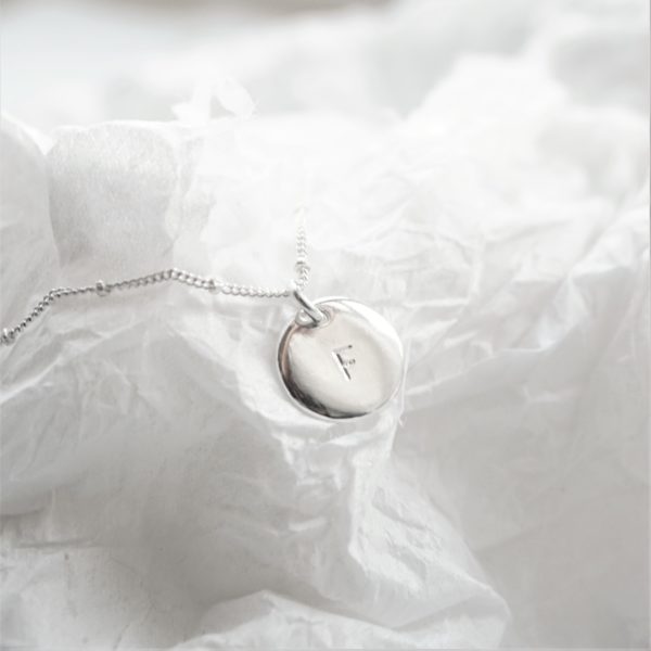 Sterling silver necklace with stamped initial disc