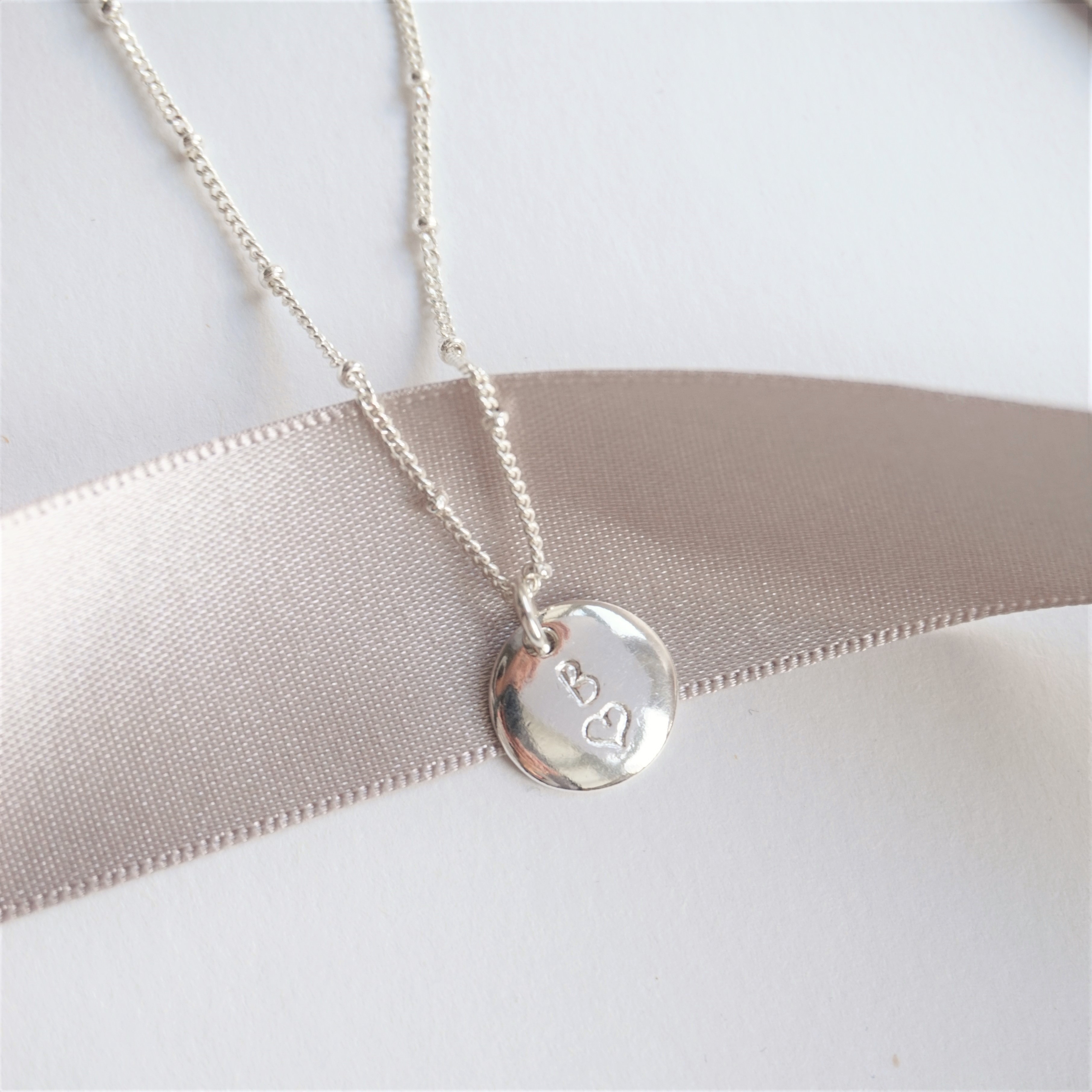 sterling silver necklace with stamped initial heart charm