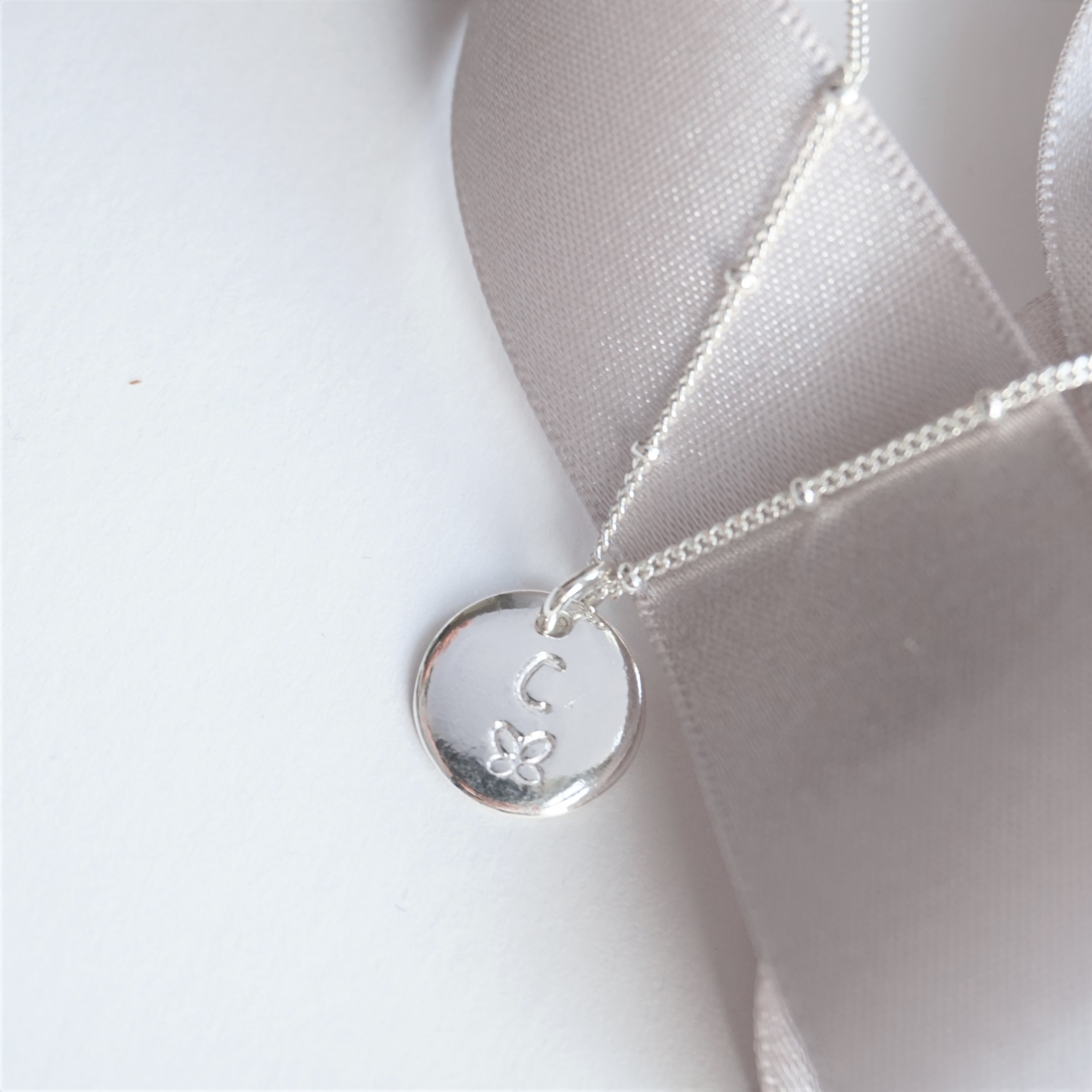 sterling silver initial butterfly stamped disc necklace