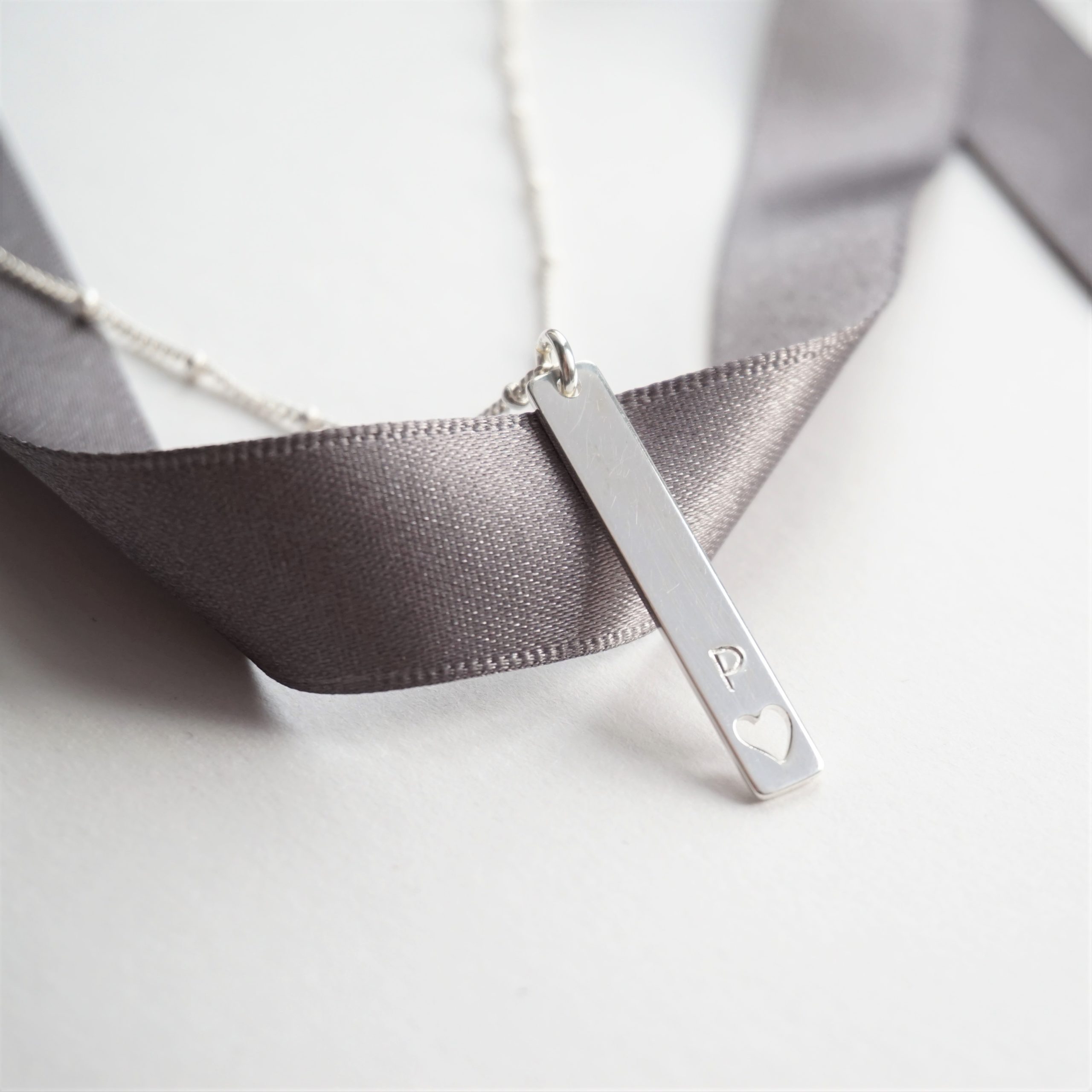 sterling silver necklace with stamped rectangular charm