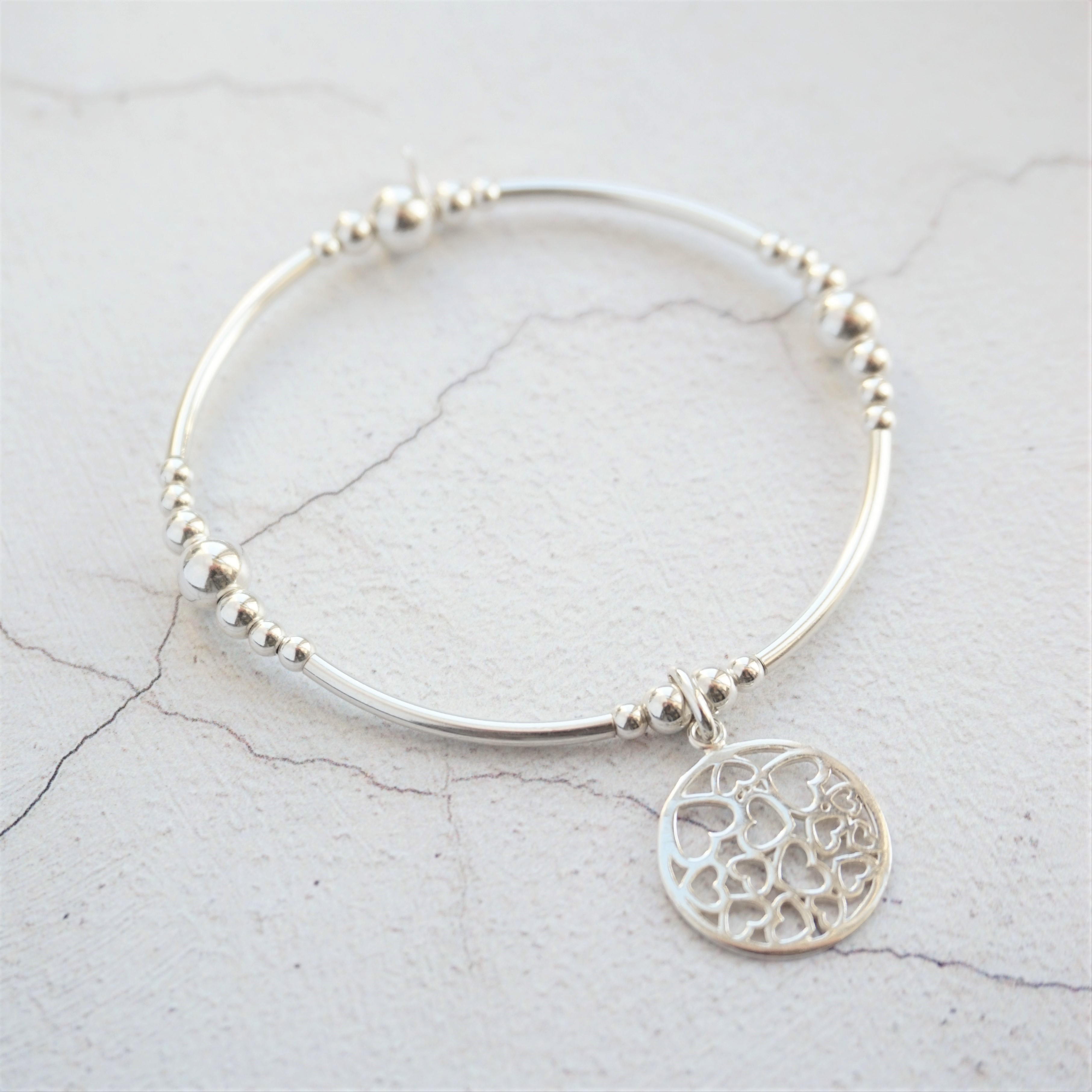 sterling silver chunky noodle bracelet with hearts in circle charm