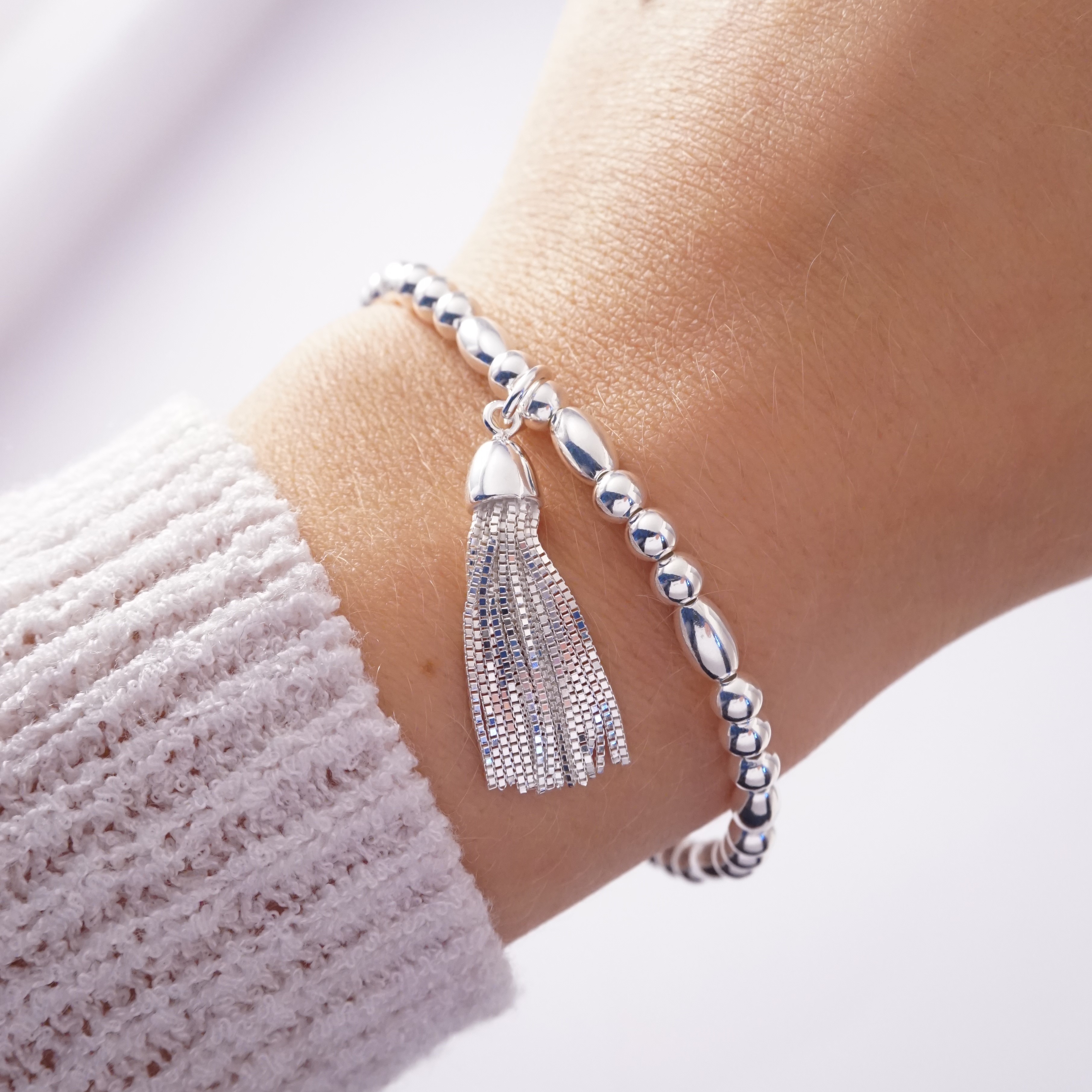 sterling silver bracelet with curb chain tassel