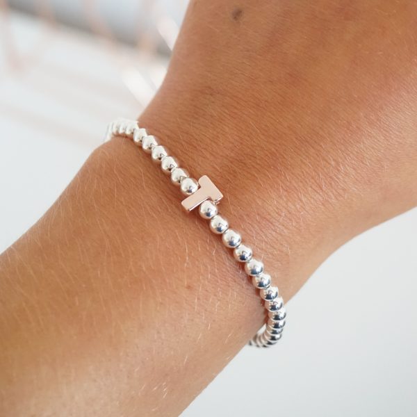 Sterling silver bracelet with rose gold initial