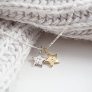 Sterling silver necklace with stamped initial gold and silver star charms