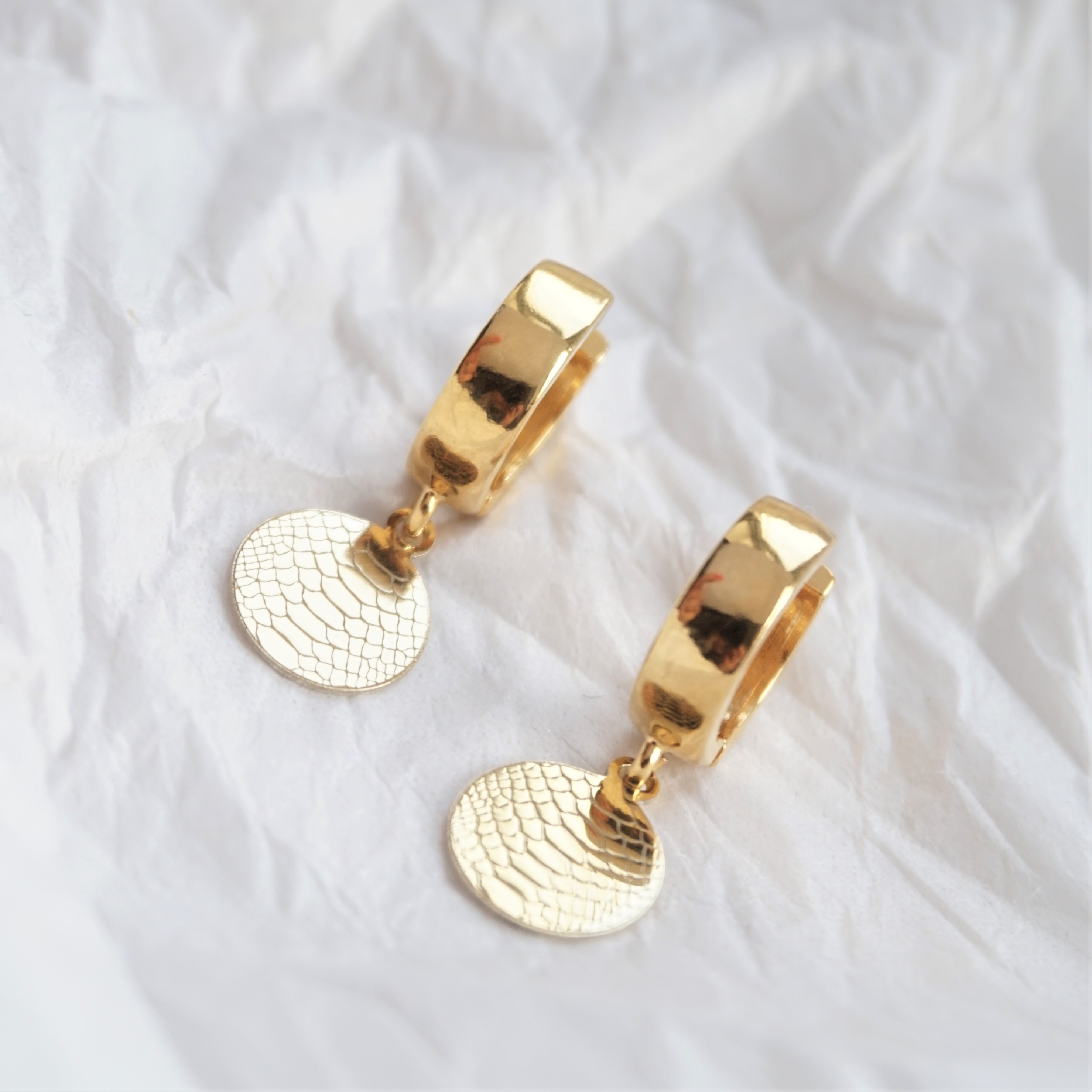 gold hoop earrings with snakeskin discs