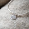 sterling silver beaded noodle bracelet with stamped initial disc