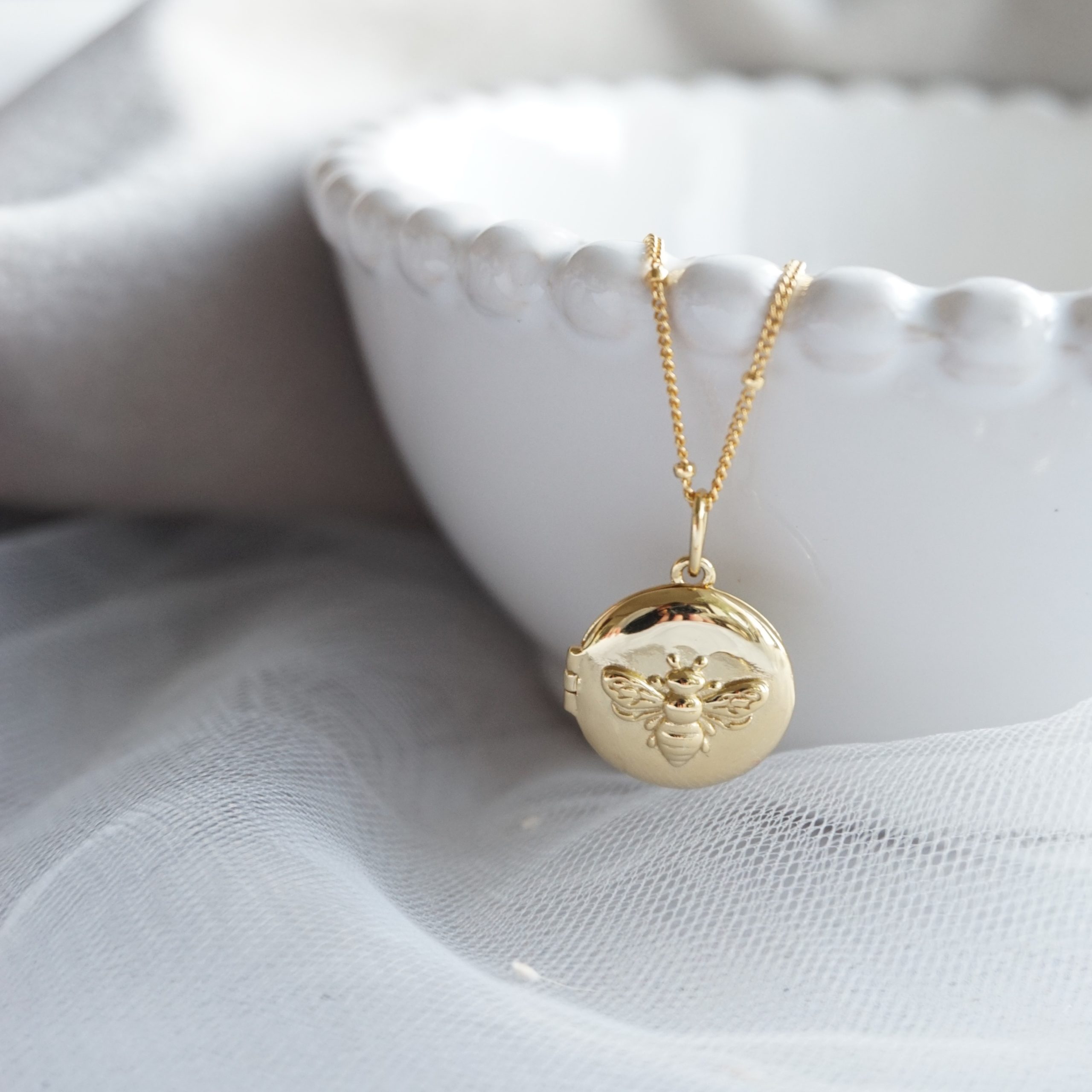 gold bee locket necklace