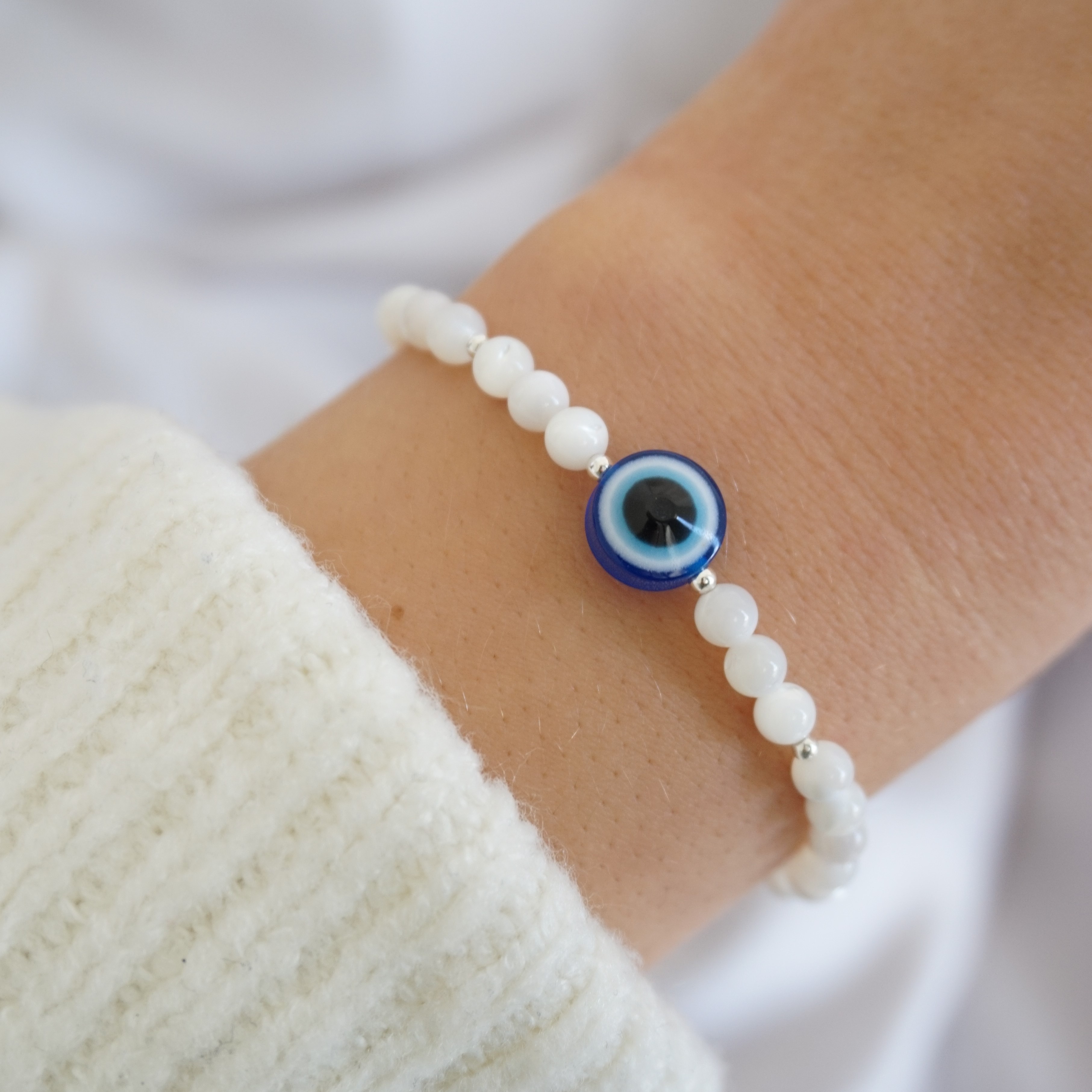 sterling silver and mother of pearl bracelet with evil eye