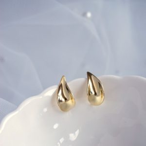 gold arc stud earrings
