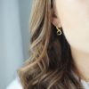 gold fig and twist hoop earrings