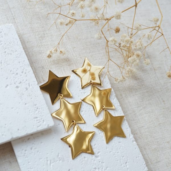 Gold maxi star drop earrings